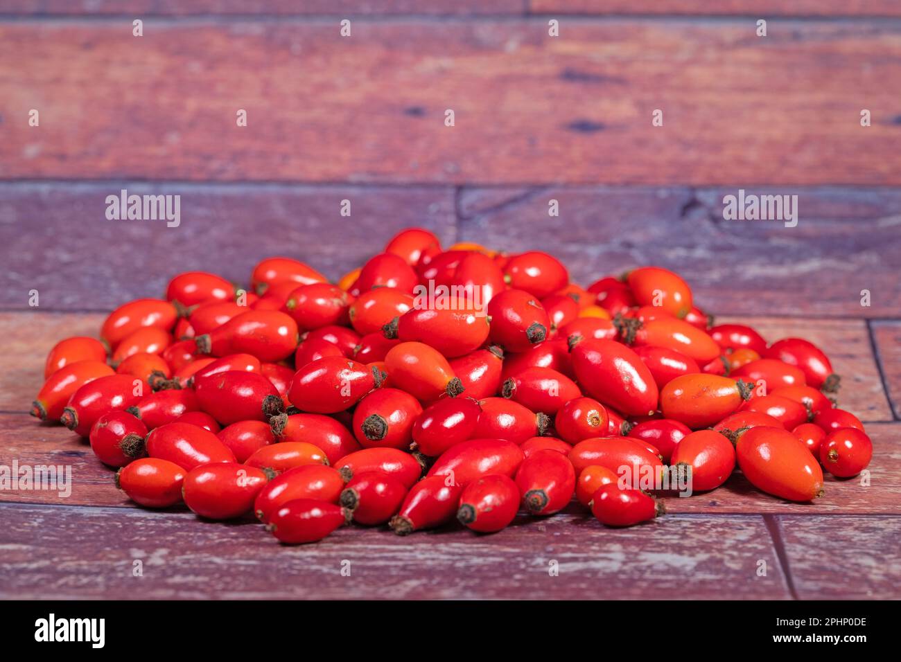 Ripe harvested rosehips on a heap Stock Photo