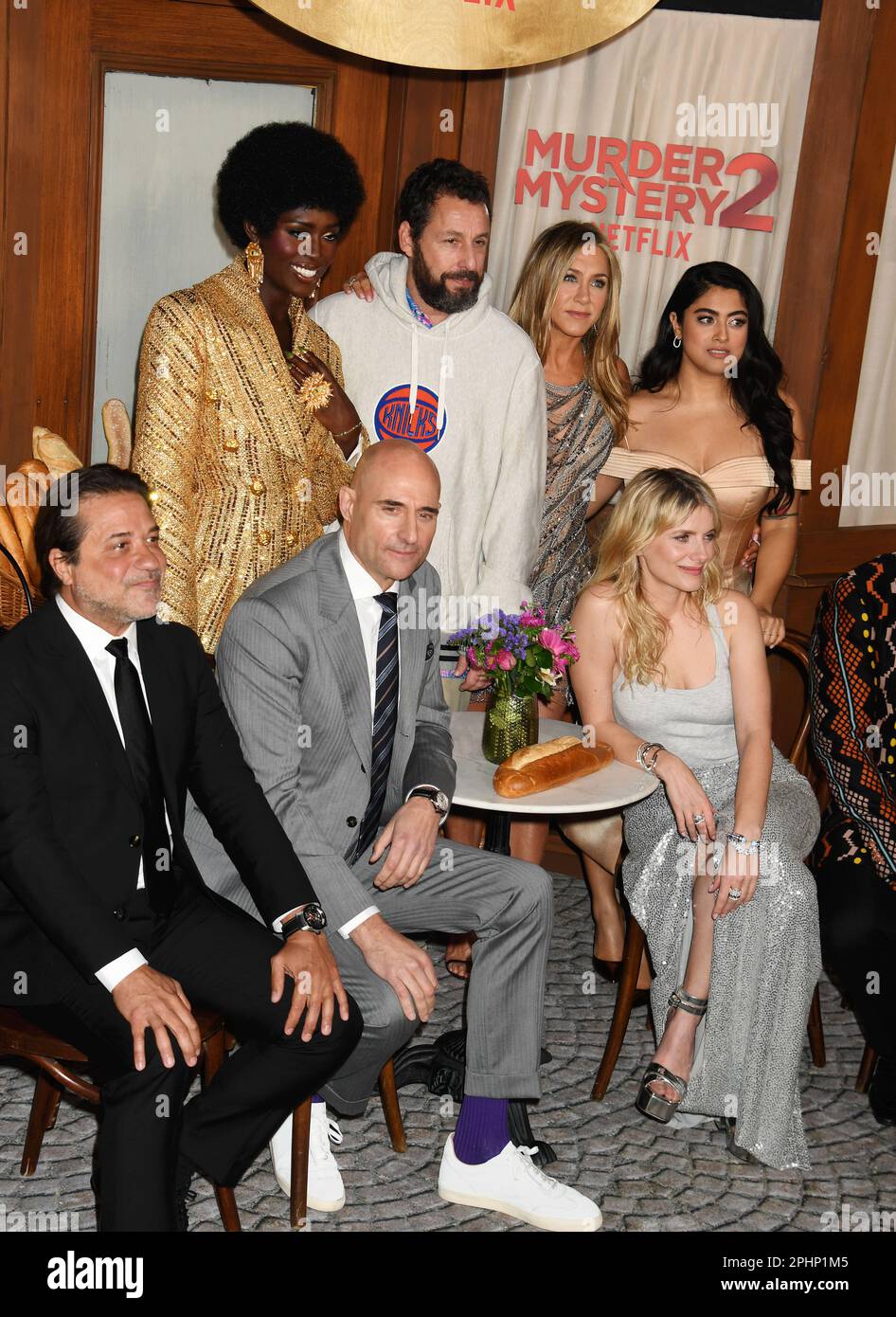 Los Angeles, California, USA. 28th Mar, 2023. (L-R) Enrique Arce, Jodie Turner-Smith, Mark Strong, Adam Sandler, Jennifer Aniston, Mélanie Laurent, Kuhoo Verma and Dr. John Kani attend the Los Angeles Premiere of Netflix's 'Murder Mystery 2' at Regency Village Theatre on March 28, 2023 in Los Angeles, California. Credit: Jeffrey Mayer/Jtm Photos/Media Punch/Alamy Live News Stock Photo