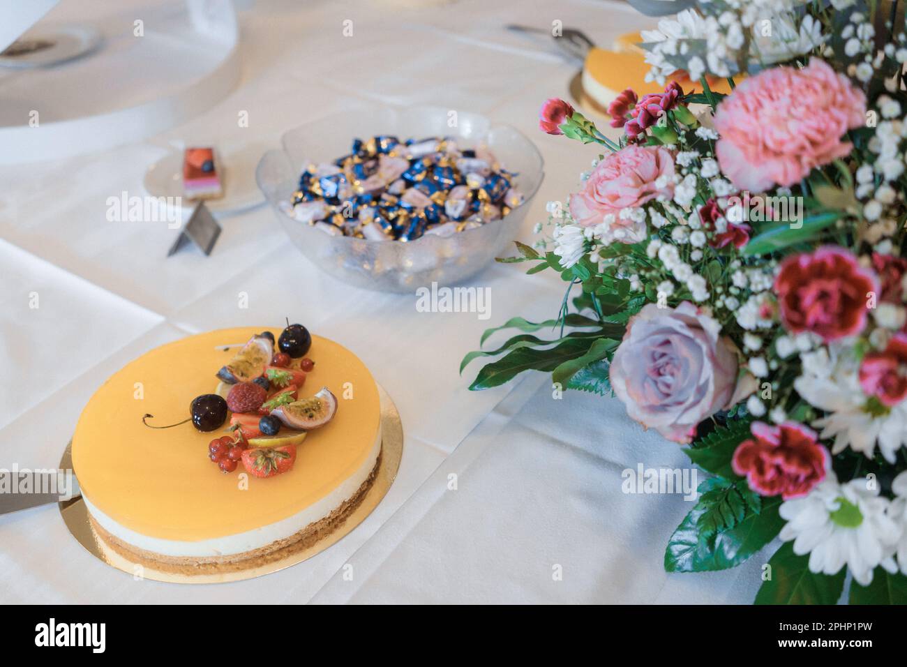 easter table setting with cake and sweets  with cake servers, wedding candy bar Stock Photo