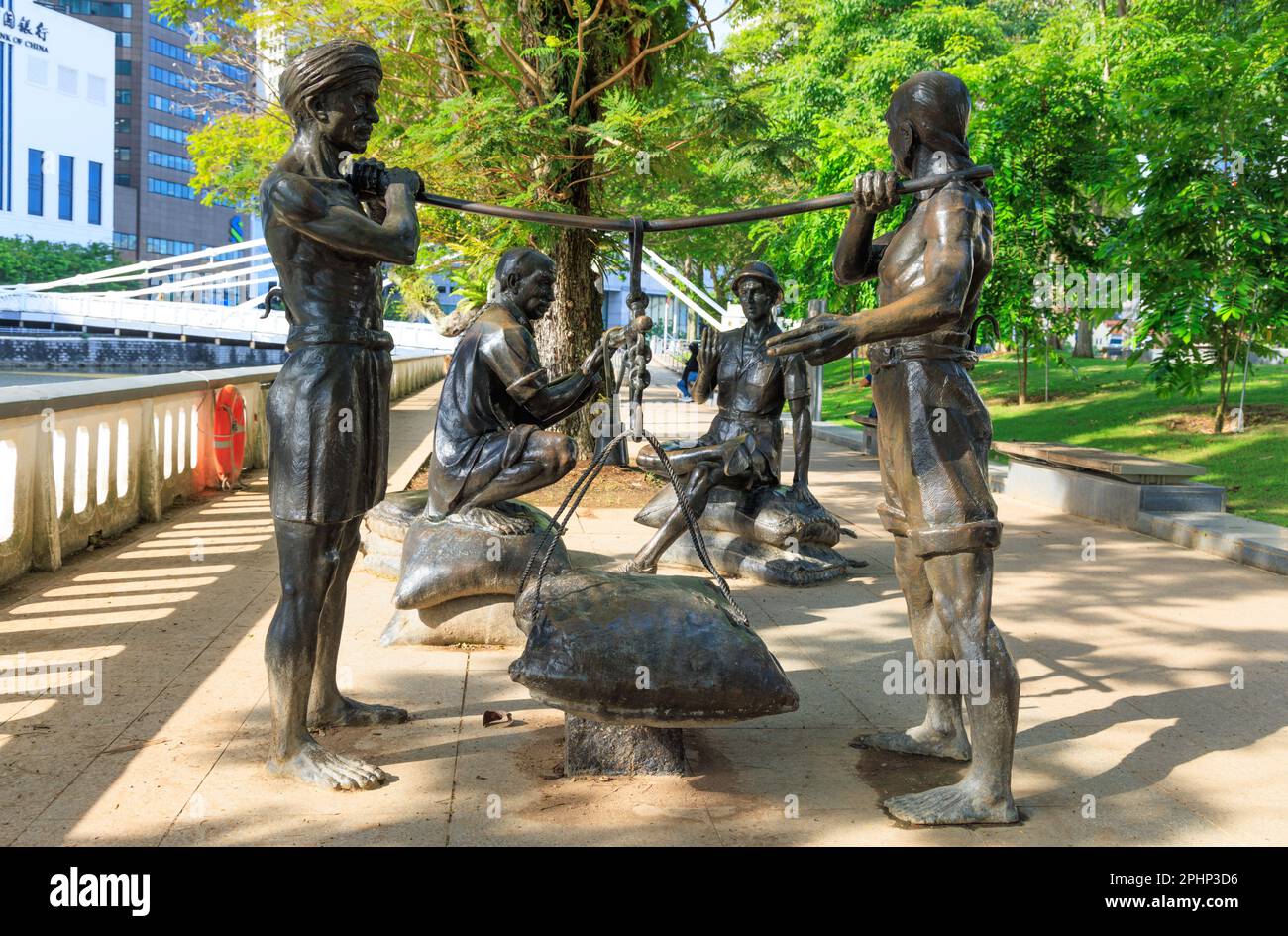 'A Great Emporium' statues beside Singapore River Stock Photo