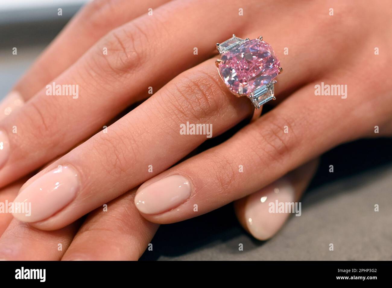 New York, USA. 28th Mar, 2023. Shown at Sotheby's New York, a hand model wears ‘The Eternal Pink' internally flawless pink diamond weighing 10.57 Carats, which is expected to bring over $35 million at auction this summer, New York, NY, March 28, 2023. (Photo by Anthony Behar/Sipa USA) Credit: Sipa USA/Alamy Live News Stock Photo