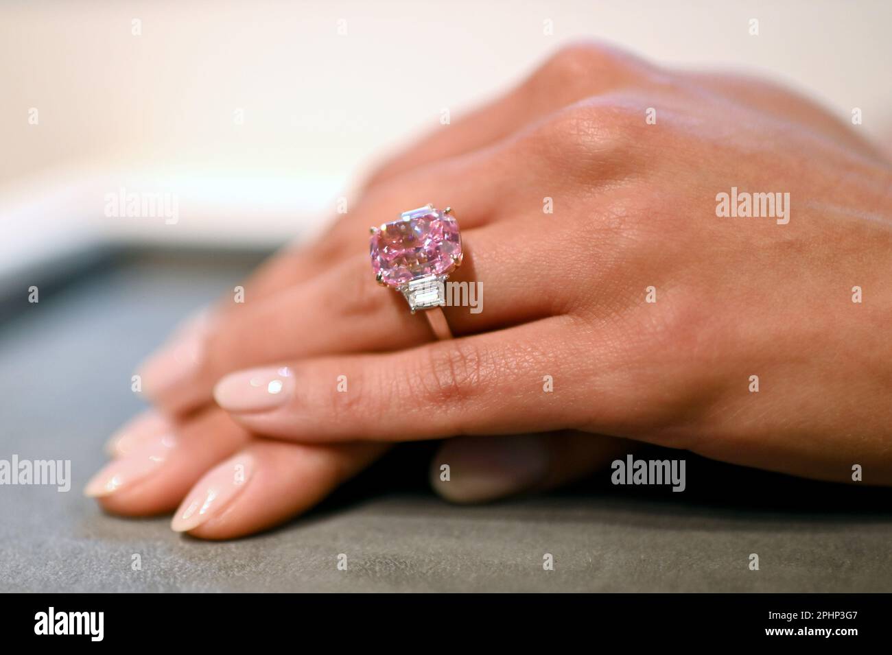 New York, USA. 28th Mar, 2023. Shown at Sotheby's New York, a hand model wears ‘The Eternal Pink' internally flawless pink diamond weighing 10.57 Carats, which is expected to bring over $35 million at auction this summer, New York, NY, March 28, 2023. (Photo by Anthony Behar/Sipa USA) Credit: Sipa USA/Alamy Live News Stock Photo