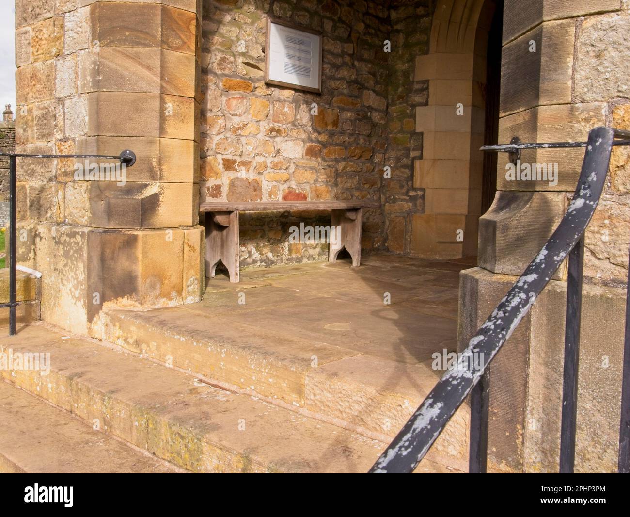 St Leonard's Church, Entrance Porch with old wooden bench Downham, Lancashire, United Kingdom, Stock Photo