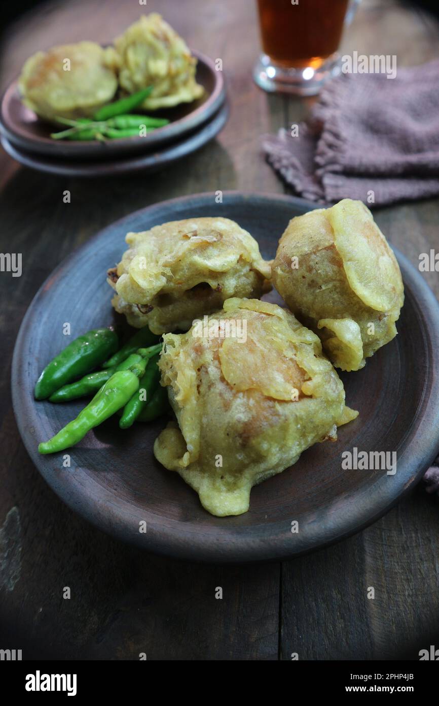 Flour fried tofu with green chilies on a clay plate Stock Photo Alamy