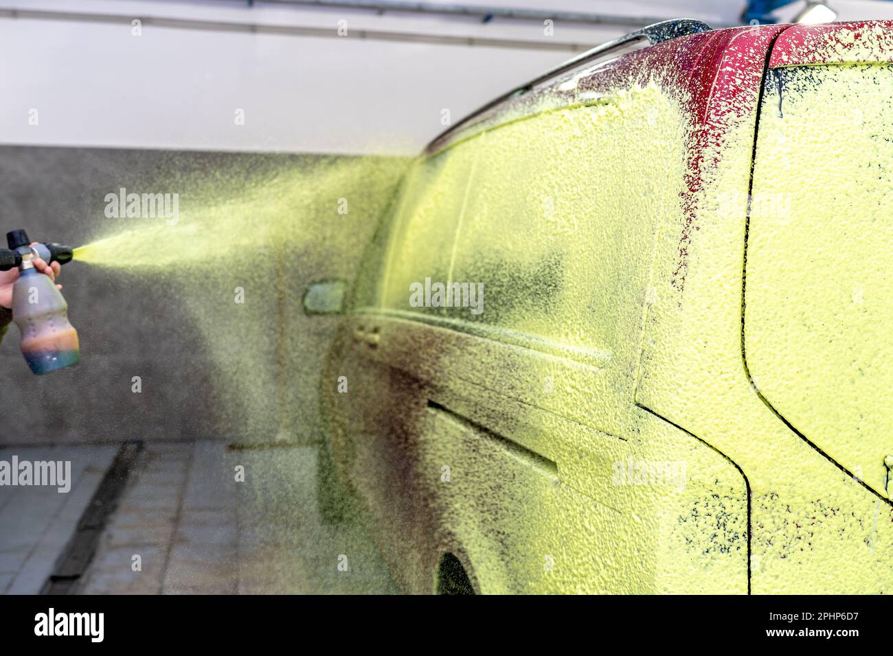 wash cars with green active foam in the garage Stock Photo