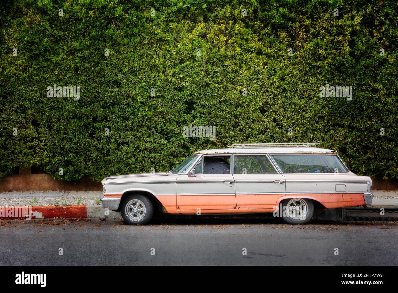 A mid sixties station wagon sits on the street in Hollywood, California. Stock Photo