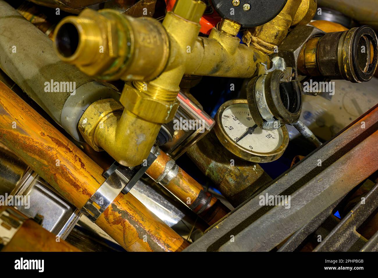 Waste with various components of an old heating system after renovation