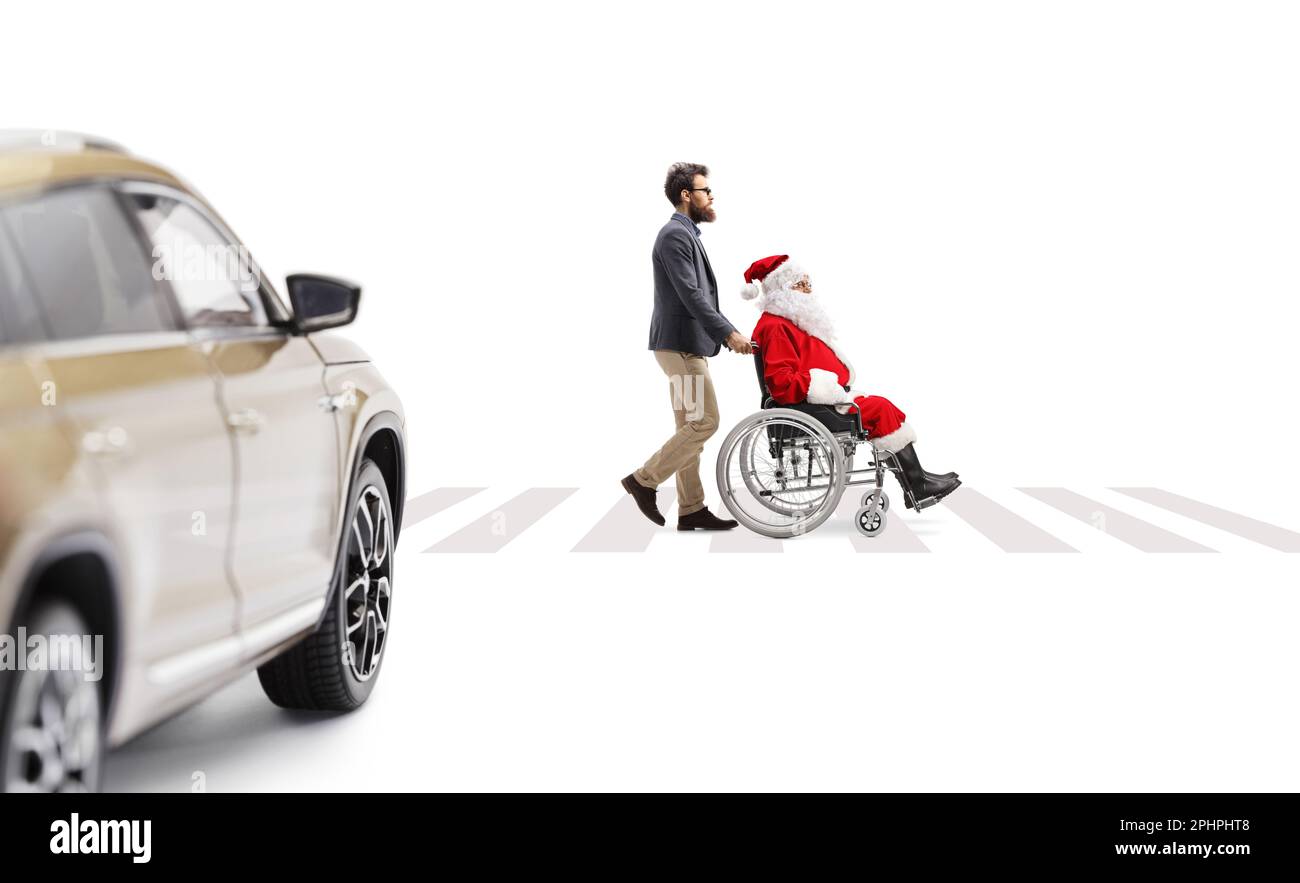 Santa Using A Walker Full length profile shot of a man pushing santa claus in a wheelchair ...