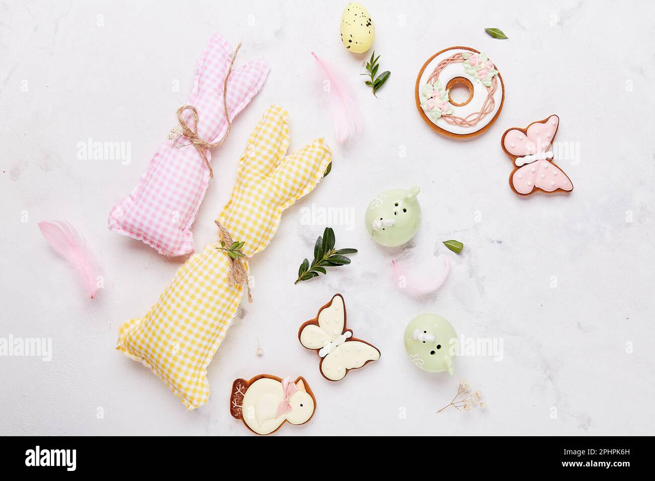 Easter traditional colorful cookies with handmade crafting bunny toys. Happy Easter background. Stock Photo