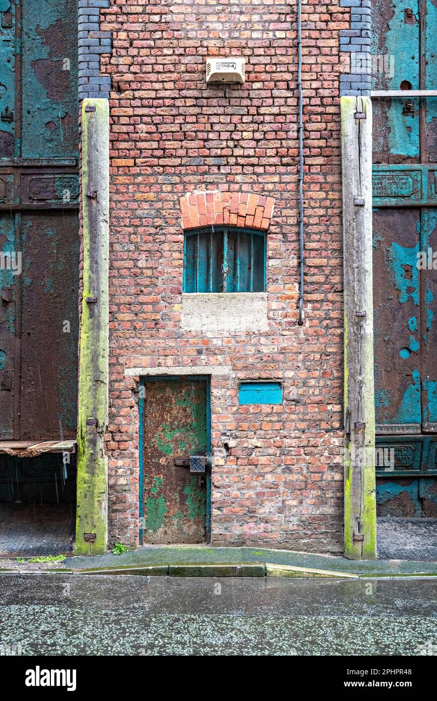 Steel doors to Liverpool dockland warehouse Stock Photo