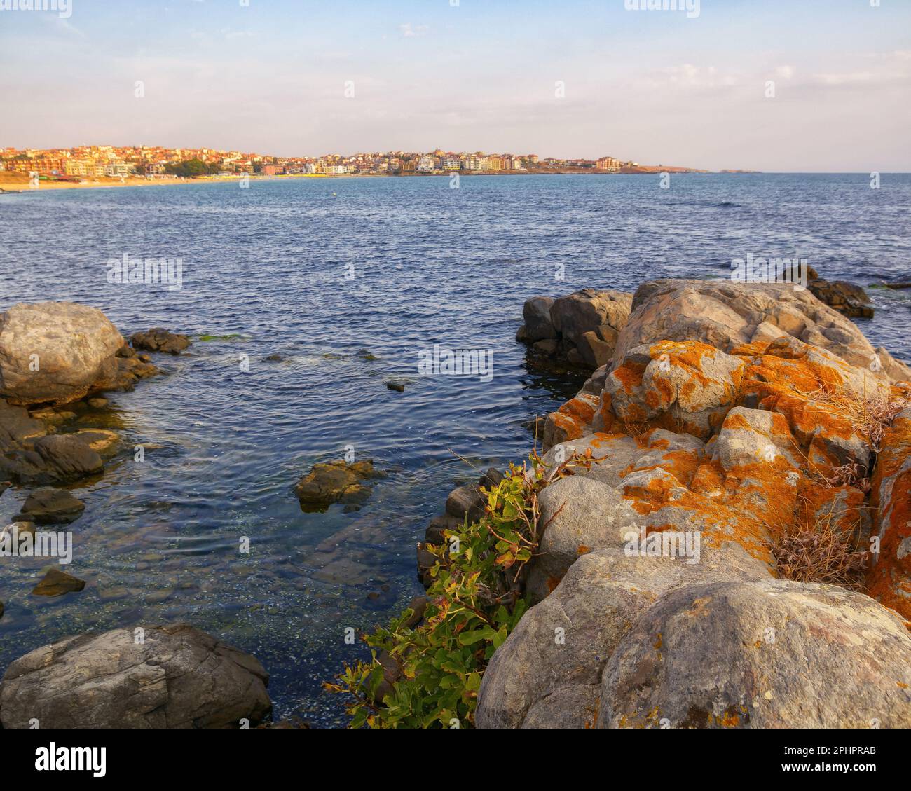 rocks on the seaside of resort town. vacation and leisure background in ...