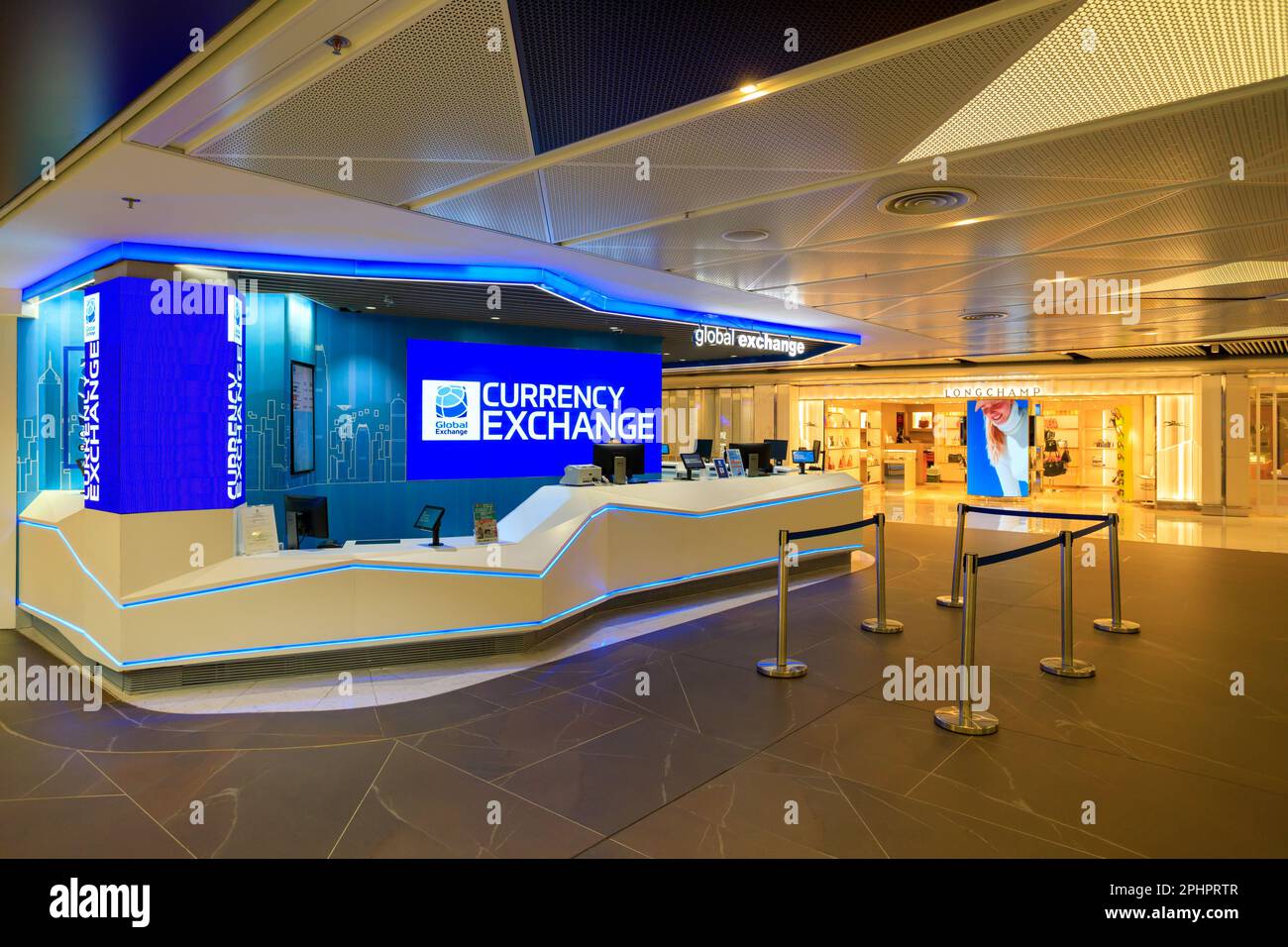 Hong Kong - February 28, 2023: Exterior of a foreign currency exchange store in the departure lounge of the Hong Kong International airport. Stock Photo