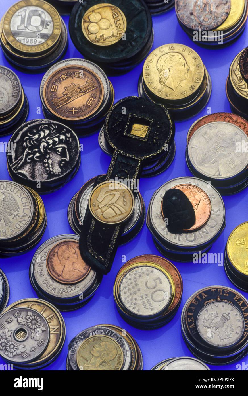 PILES OF OLD NATIONAL AND HISTORIC COINS Stock Photo
