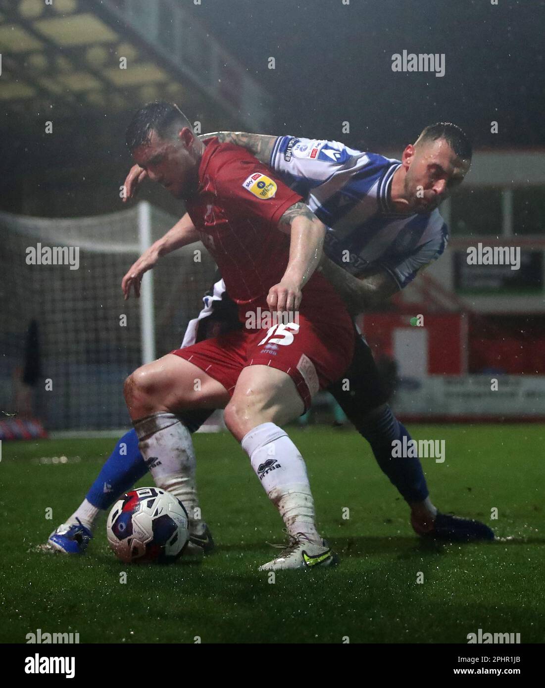 Sheffield Wednesday's Jack Hunt (right) and Cheltenham Town's Will Ferry battle for the ball during the Sky Bet League One match at the Completely-Suzuki Stadium, Cheltenham. Picture date: Wednesday March 29, 2023. Stock Photo