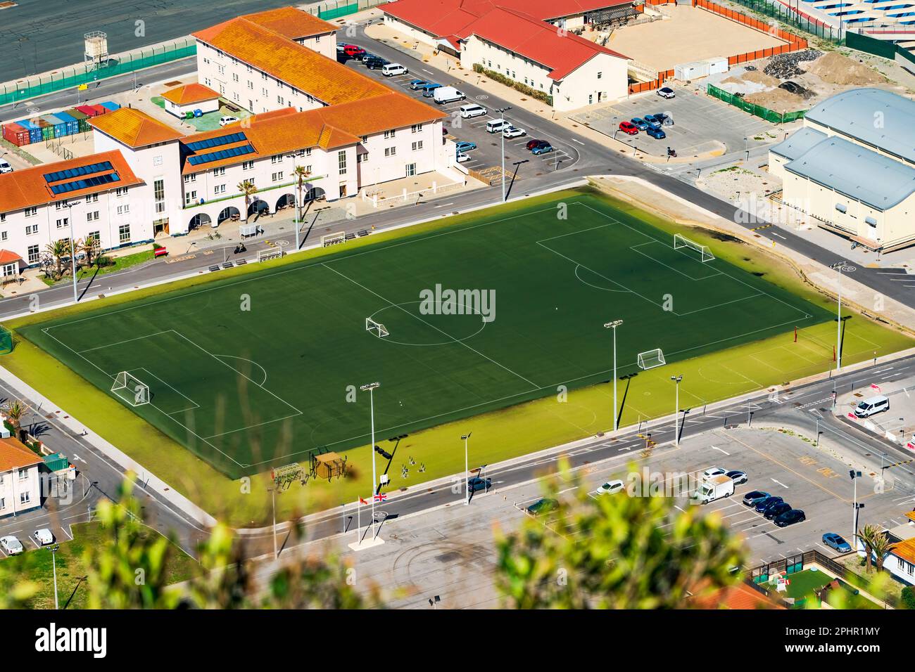 Aerial view of a stadium pitch in Gibraltar town seen from the Upper