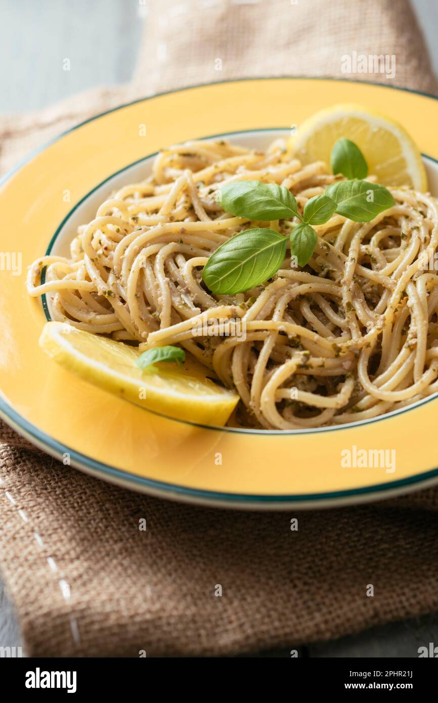 Spaghetti with a home made lemony kale and walnut pesto. Stock Photo