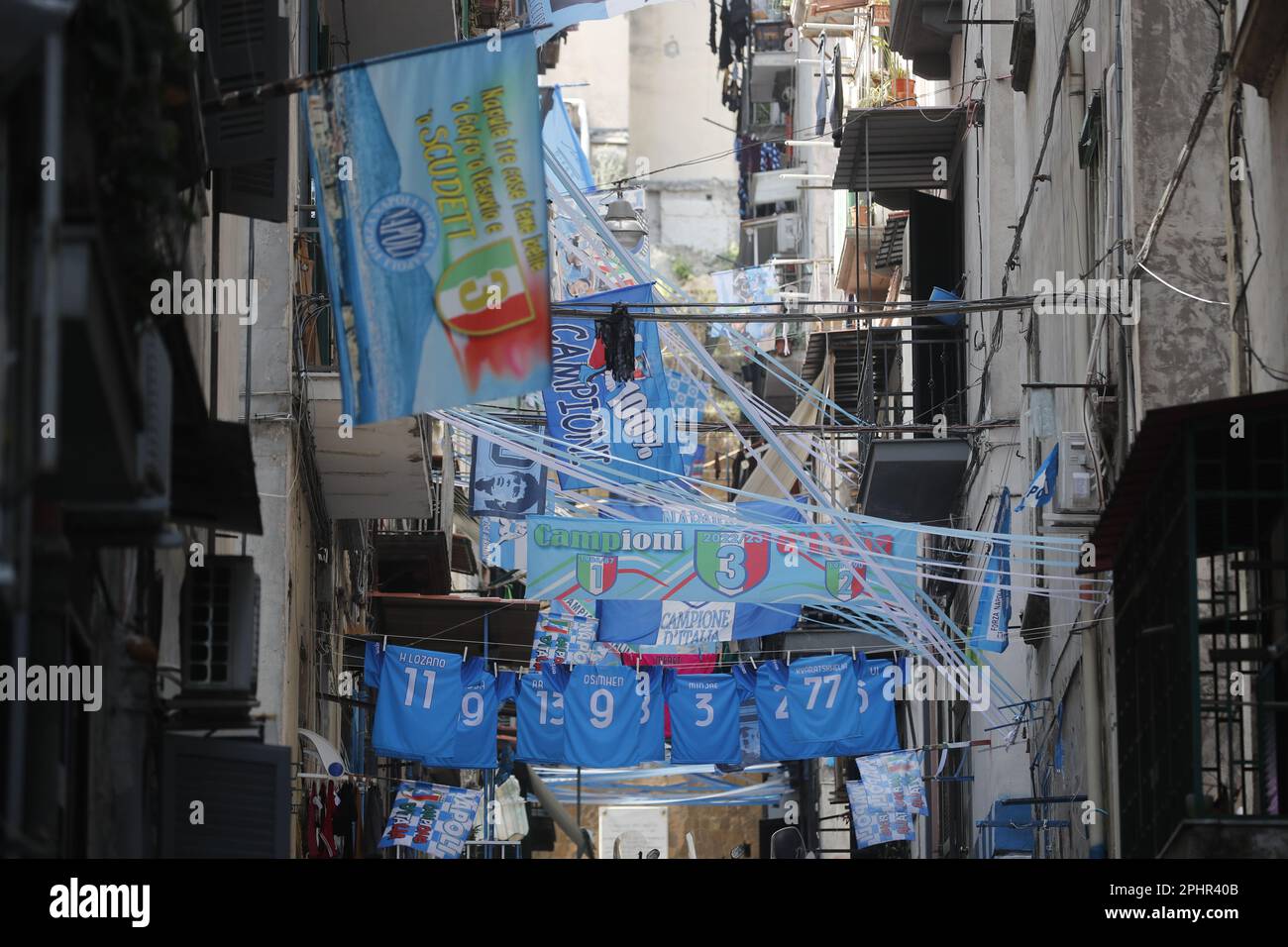 Naples, Italy. 22nd Mar, 2023. Banners and ribbons with the colors of the SSC Napoli soccer team and an effigy of the 'scudetto' (the symbol with the colors of the Italian flag that is affixed to the jersey of the team that wins the Italian Serie A soccer championship) are displayed downtown. Preparations are in full swing in the city to celebrate the final victory of SSC Napoli, which leads the Italian championship with a 19-point lead with 11 games to go. Credit: Independent Photo Agency/Alamy Live News Stock Photo