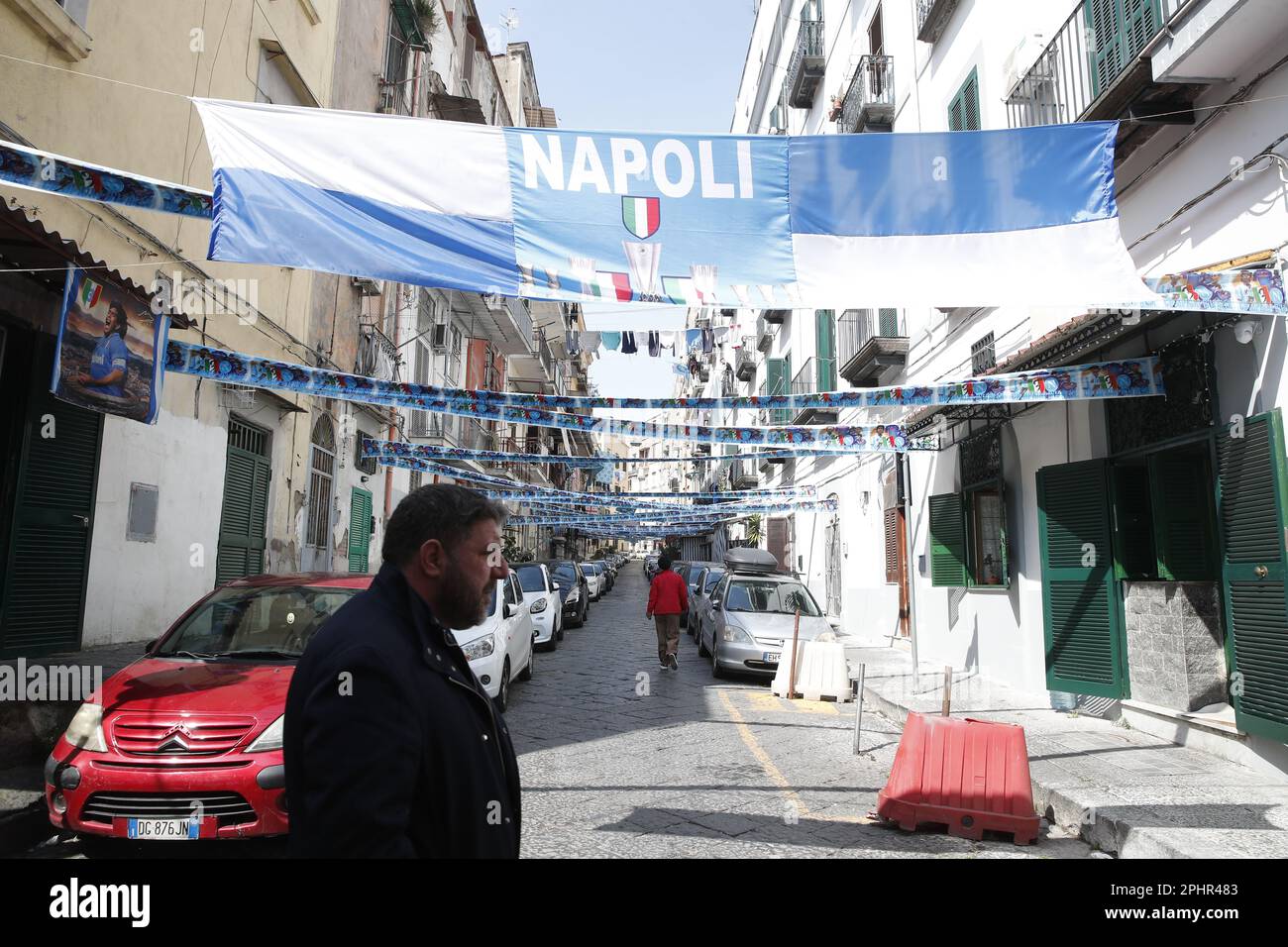 Naples, Italy. 22nd Mar, 2023. Banners and ribbons with the colors of the SSC Napoli soccer team and an effigy of the 'scudetto' (the symbol with the colors of the Italian flag that is affixed to the jersey of the team that wins the Italian Serie A soccer championship) are displayed downtown. Preparations are in full swing in the city to celebrate the final victory of SSC Napoli, which leads the Italian championship with a 19-point lead with 11 games to go. Credit: Independent Photo Agency/Alamy Live News Stock Photo
