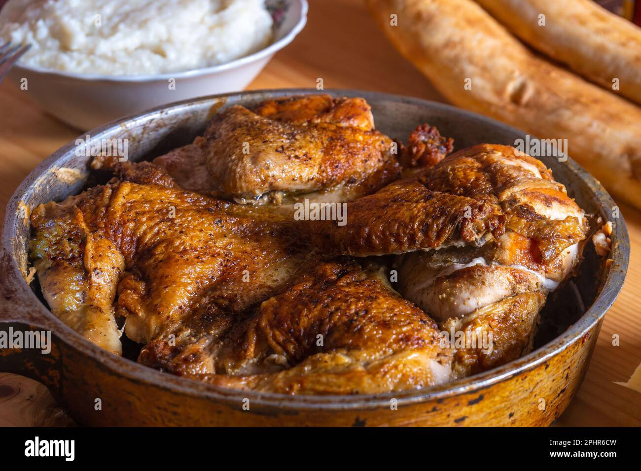 Hot Fried Chicken tobacco in a pan close-up, food Stock Photo