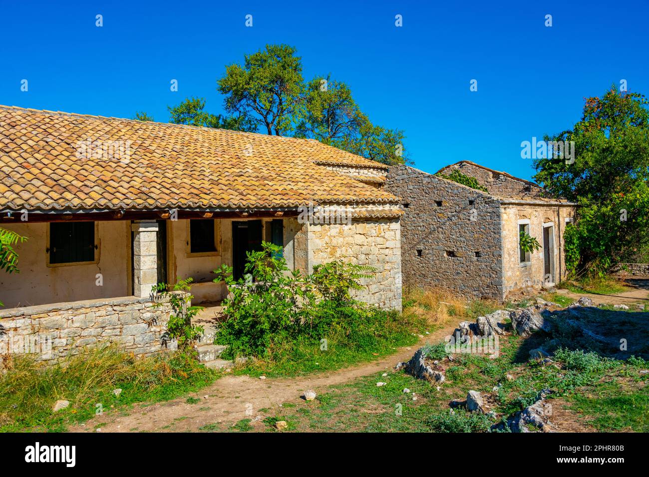 Old houses in Greek village Old perithia at island Corfu Stock Photo