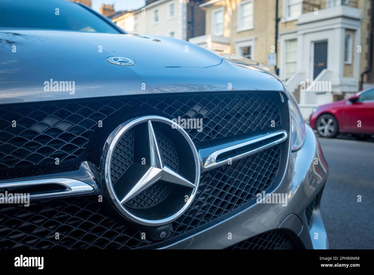 London- January 2023: Mercedes car badge logo on car parked in urban residential location Stock Photo