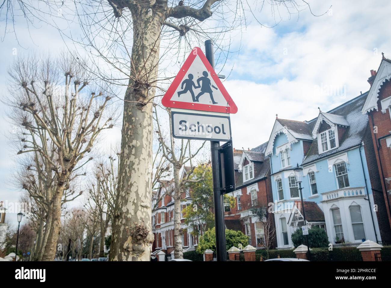 London- January 2023: Triangle warning sign of school crossing in residential area of W10 west London- North Kensington Stock Photo