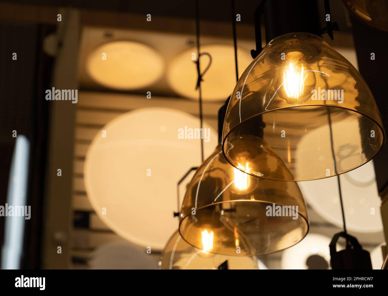 Hanging Retro Lamps, Vintage Style Industrial Lightbulbs, Stylish Warm Light Bulb in Interior, Retro Lams Stock Photo