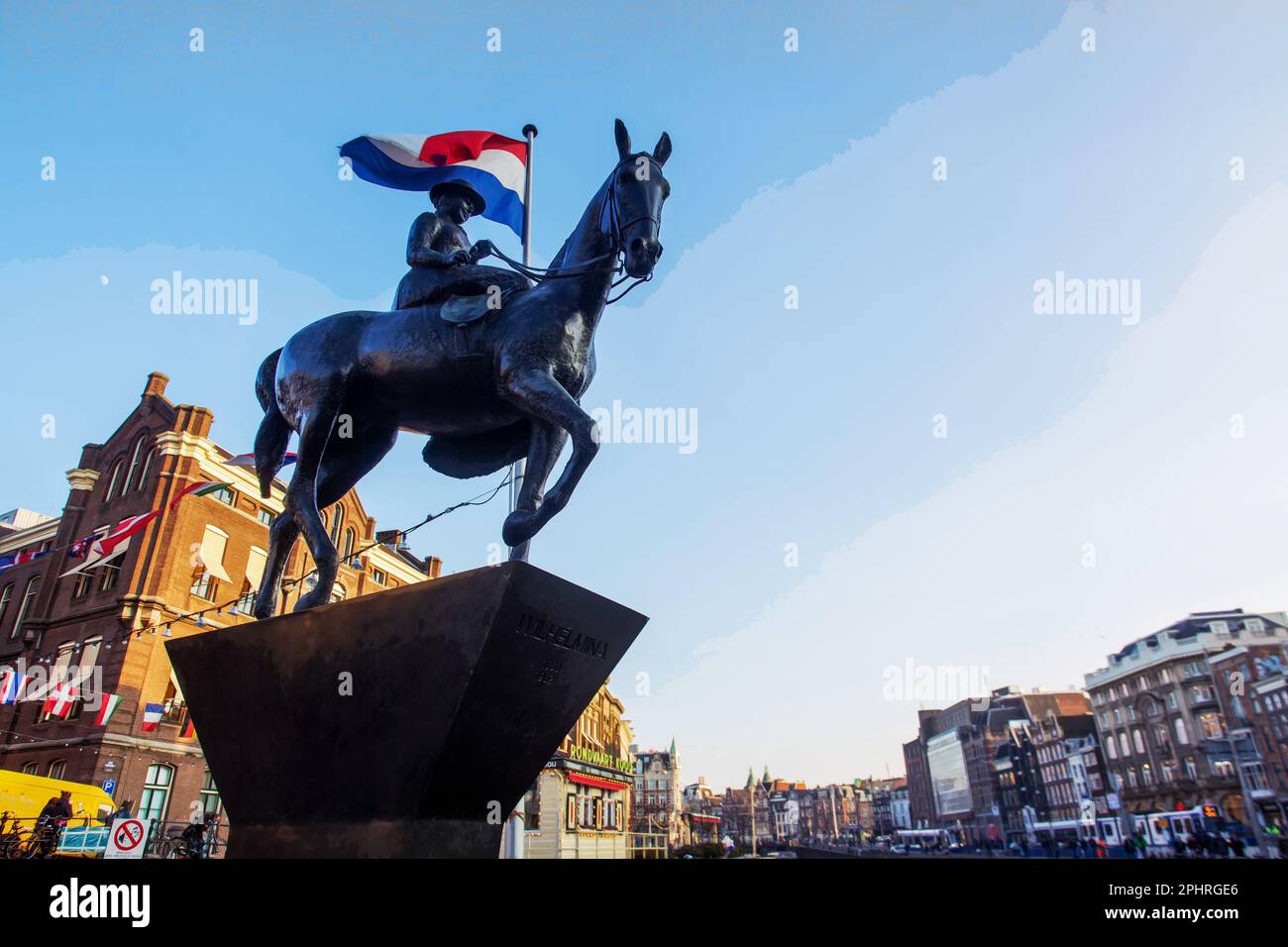 02-17-2016  Amsterdam  Netherlands. Monument to Queen Wilhelmina - equestrian bronze statue created by Dutch sculptor Theresa  van der Pant .  Flag of Stock Photo