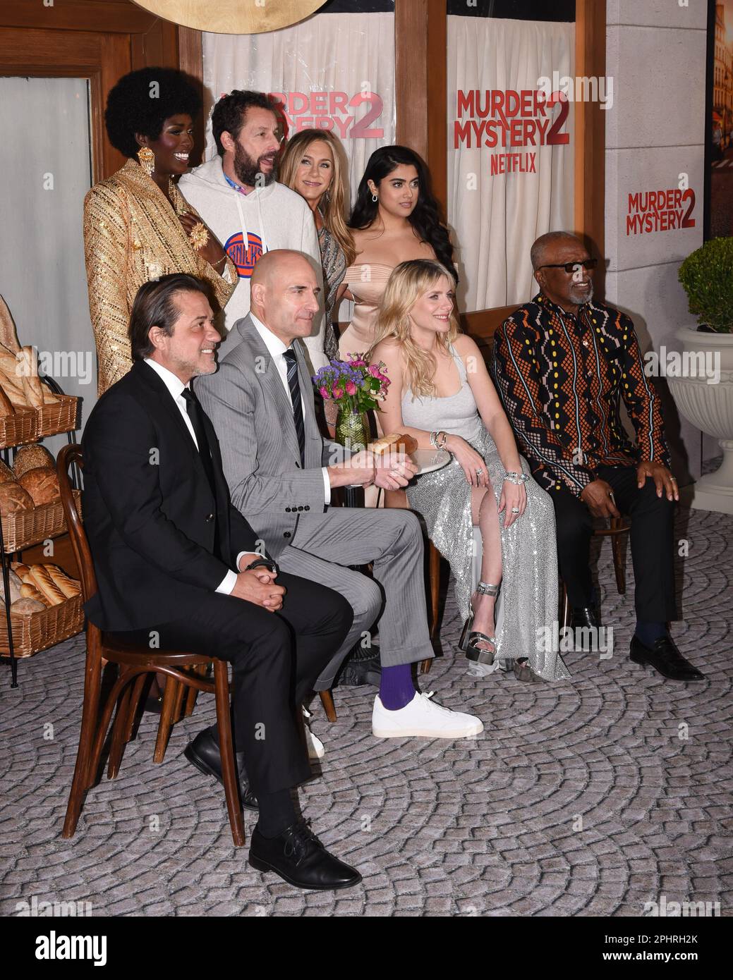 Los Angeles, USA. 28th Mar, 2023. (L-R) MURDER MYSTERY 2 Cast - Enrique  Arce, Jodie Turner-Smith, Mark Strong, Adam Sandler, Jennifer Aniston,  Mélanie Laurent, Kuhoo Verma and Dr. John Kani at the