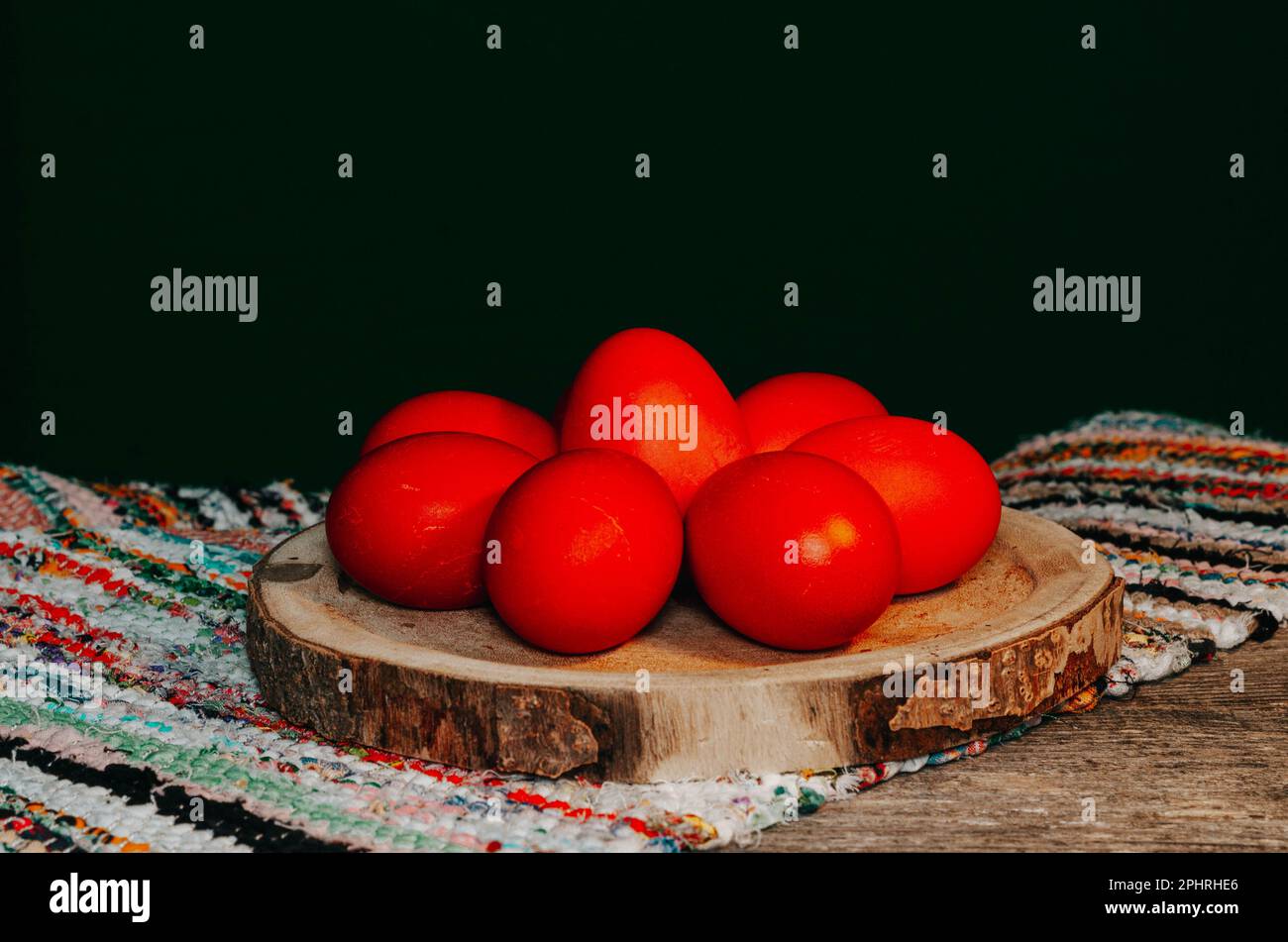 Easter eggs painted in red color on a wooden background. Happy Easter. Stock Photo