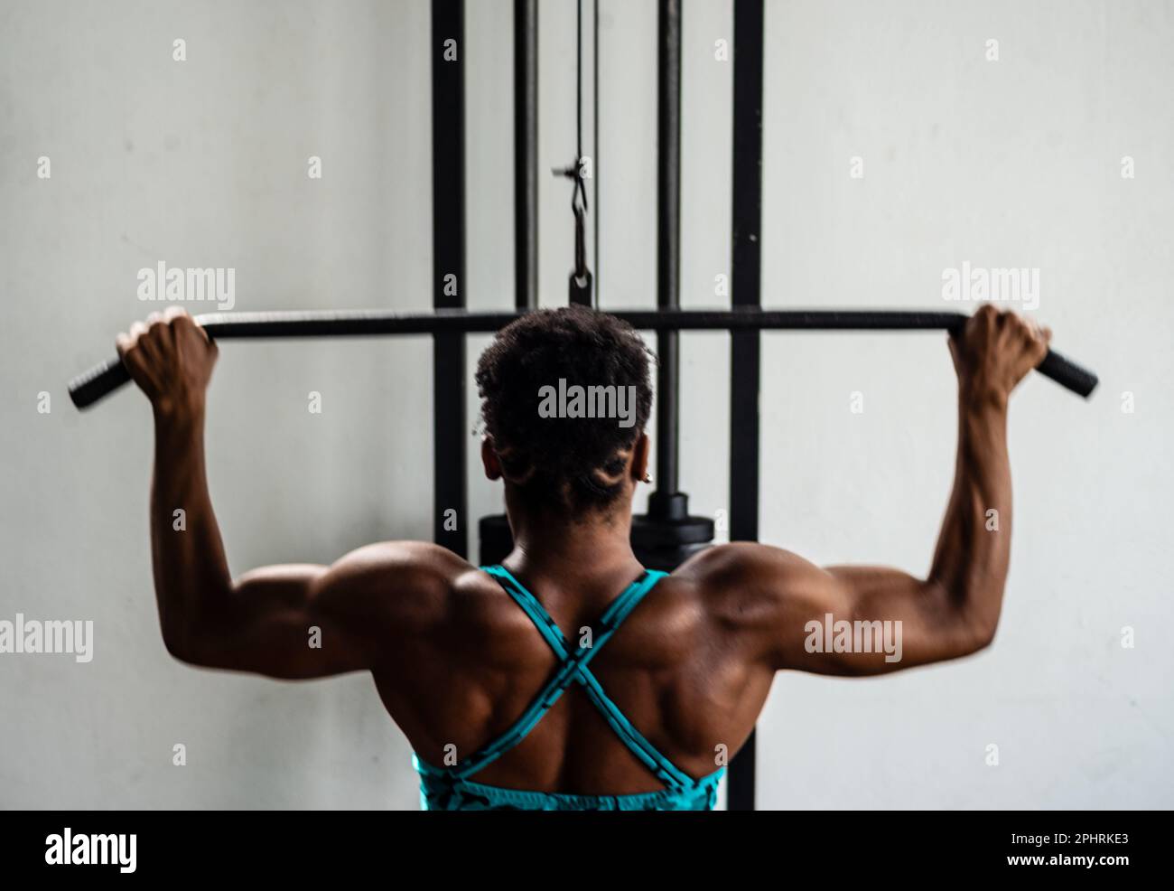 Fitness woman doing chin-ups in the gym for back workout Stock Photo - Alamy
