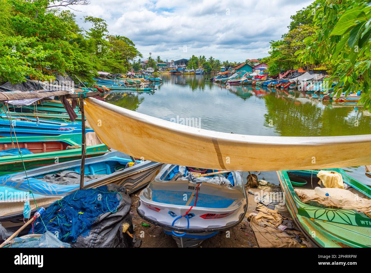 Fishing boats mooring at the shore of Negombo lagoon in Sri Lanka Stock ...