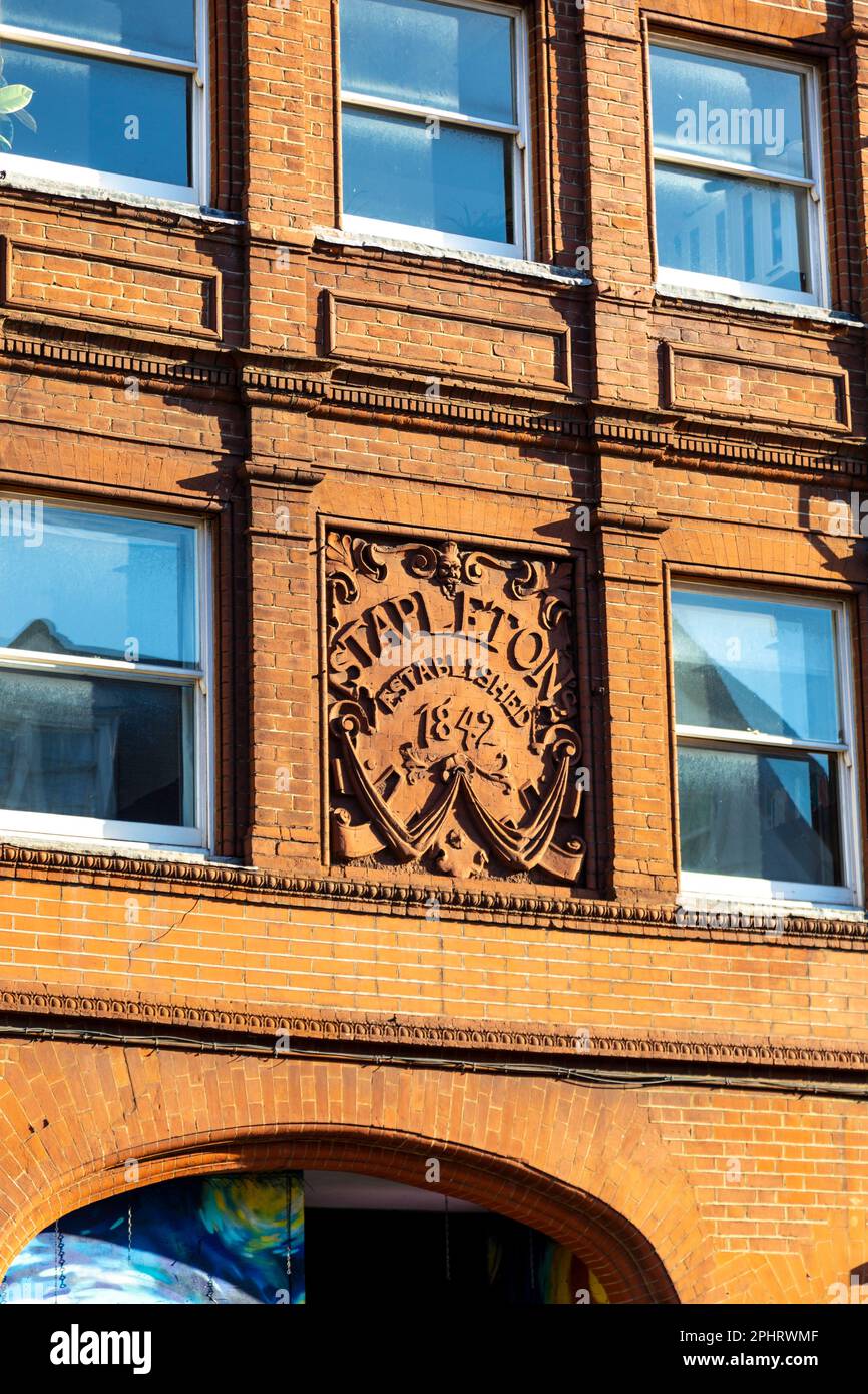 Stapleton’s Established 1842 relief above the dorr of former horse repository, Spitalfields, London, UK Stock Photo