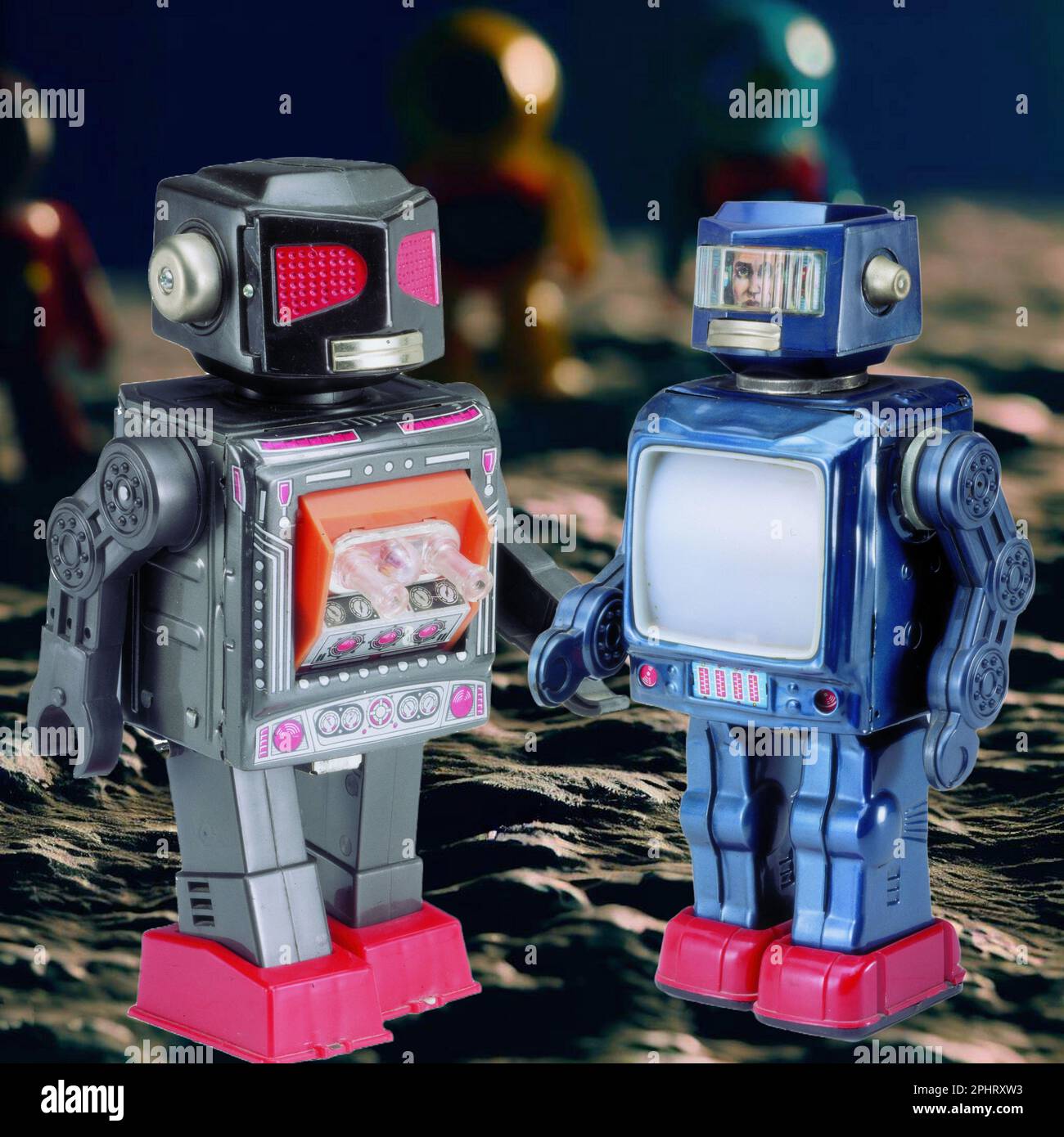 Vintage Toys, two Robot Toys in an imaginative lunar landscape Stock Photo