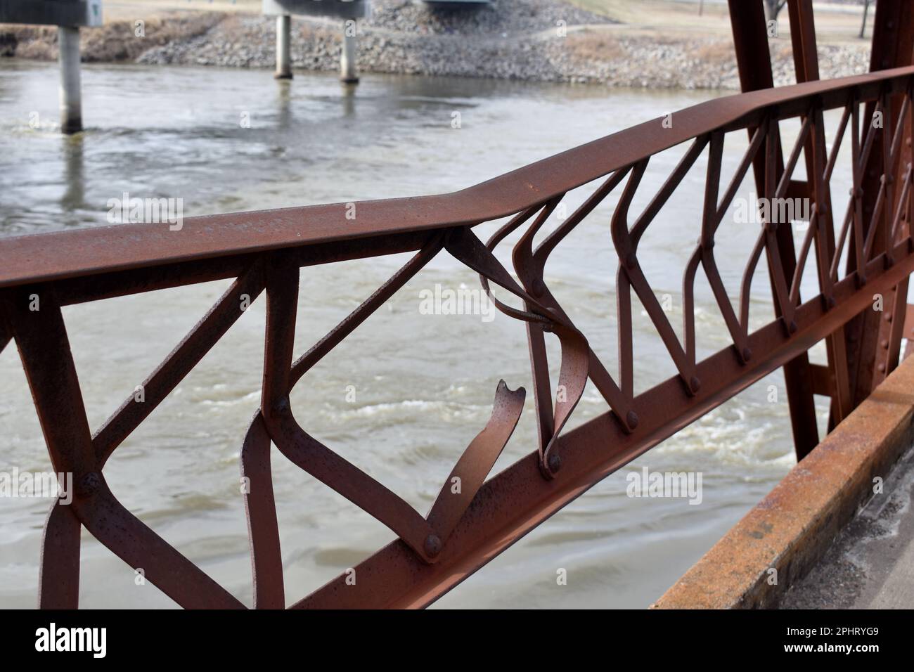 Damaged railing on the Grand Bridge, at the Neosho River (aka the Grand River) at Fort Gibson, OK.  The bridge is used as a pedestrian bridge only. Stock Photo