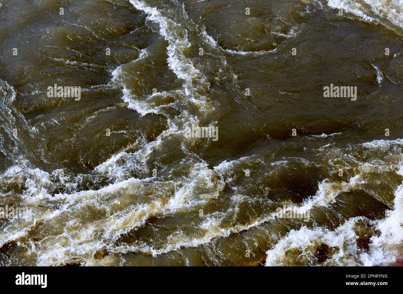 Swirling floodwaters on the Neosho River, also known as the Grand River, in Fort Gibson, Oklahoma, OK, United States, US, USA. Stock Photo