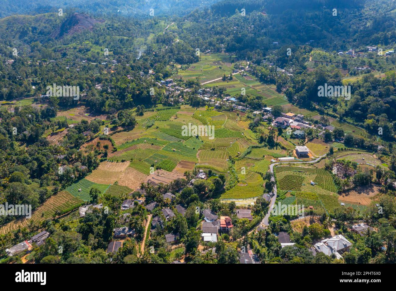Hilly landscape of Sri Lanka dotted with villages and tea plantations ...