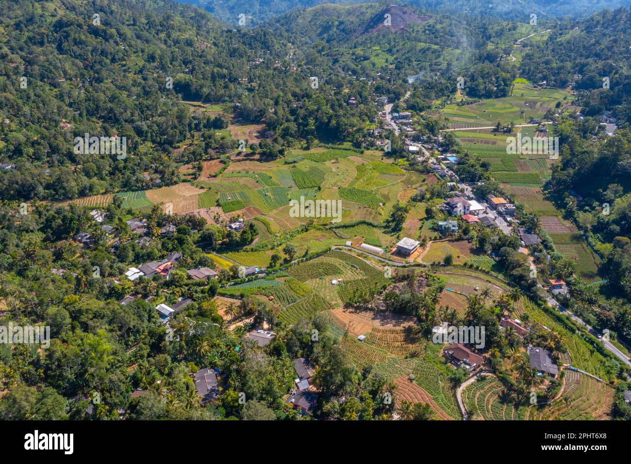 Hilly landscape of Sri Lanka dotted with villages and tea plantations ...