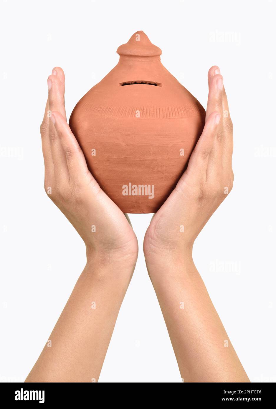 Gullak in hand isolated on white background with clipping path, indian