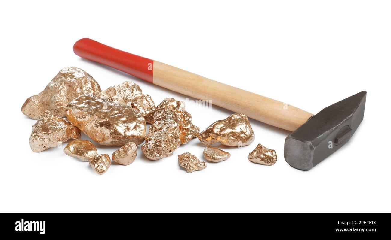 Pile of gold nuggets and hammer on white background Stock Photo - Alamy