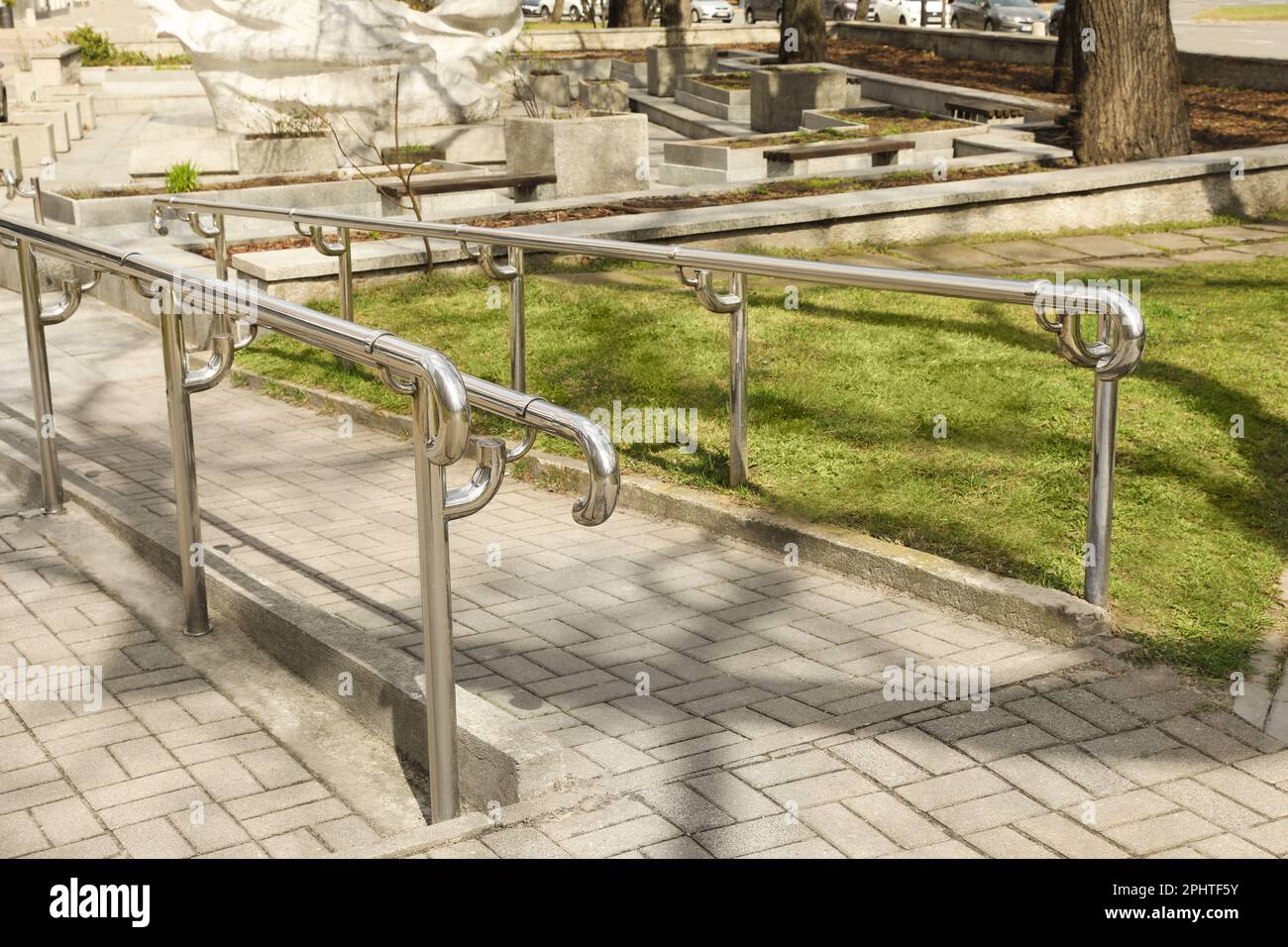 Ramp with railings in city park on sunny day Stock Photo