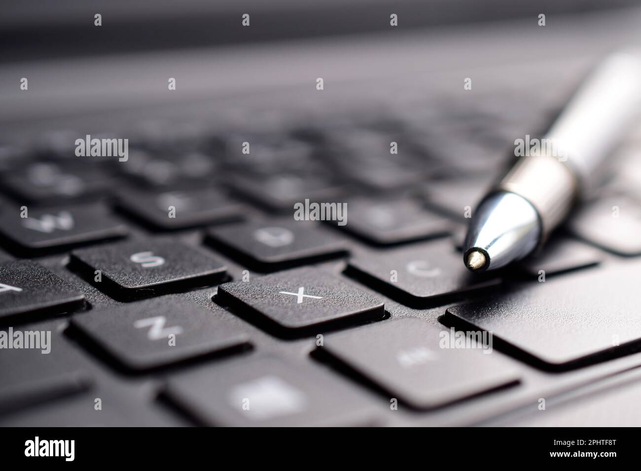 closeup of pen nib on keyboard, tip of ballpoint pen Stock Photo Alamy