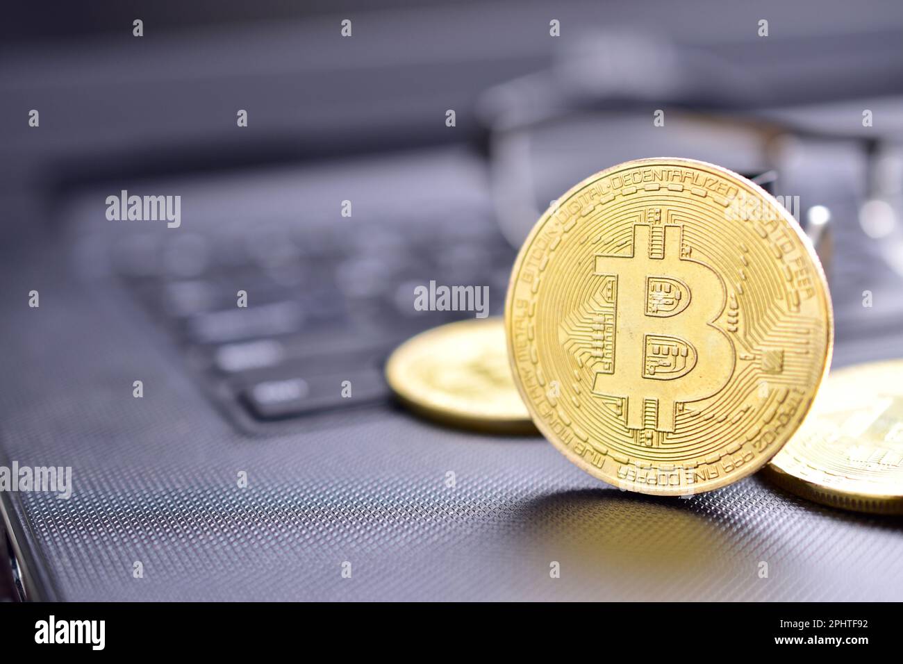 Closeup of bitcoin on computer table, cryptocurrency mining concept Stock Photo