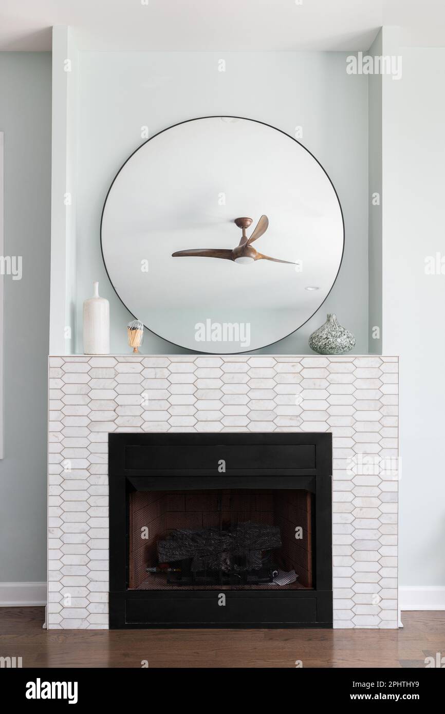 A fireplace detail with marble picket tiles around the hearth