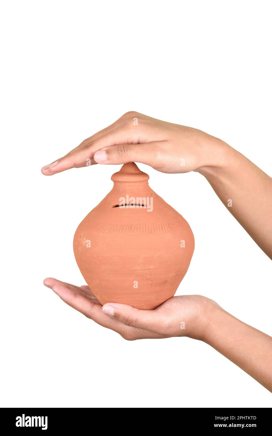 Money saving concept india, Gullak in hand isolated on white background