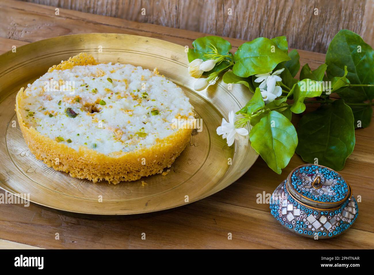 Ghewar or ghevar is a traditional sweet of rajasthan. It is made of