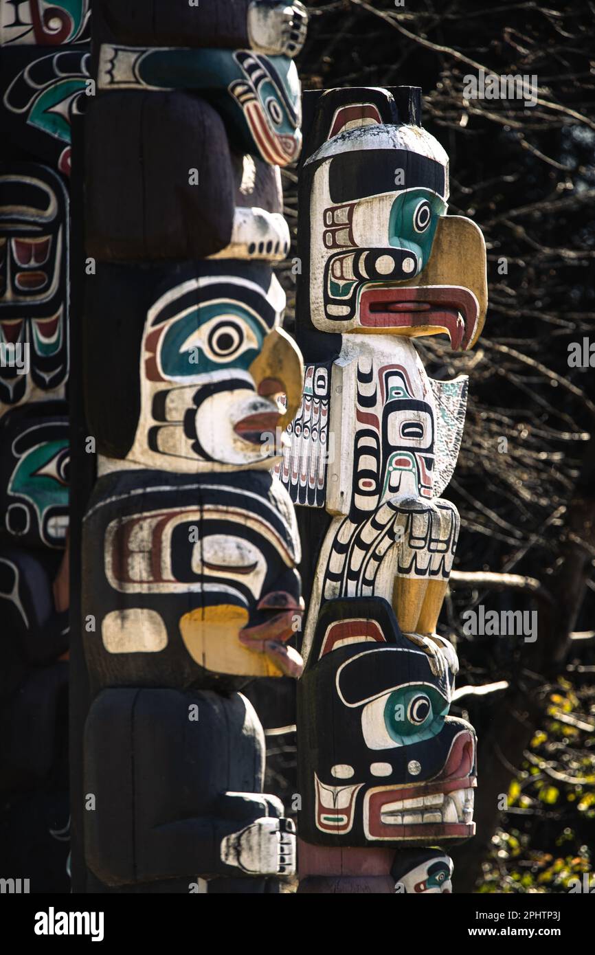 Totem Poles representing stories from Canada's First Nation's on display at Brockton Point inside Stanely Park in Vancouver, Canada. Stock Photo