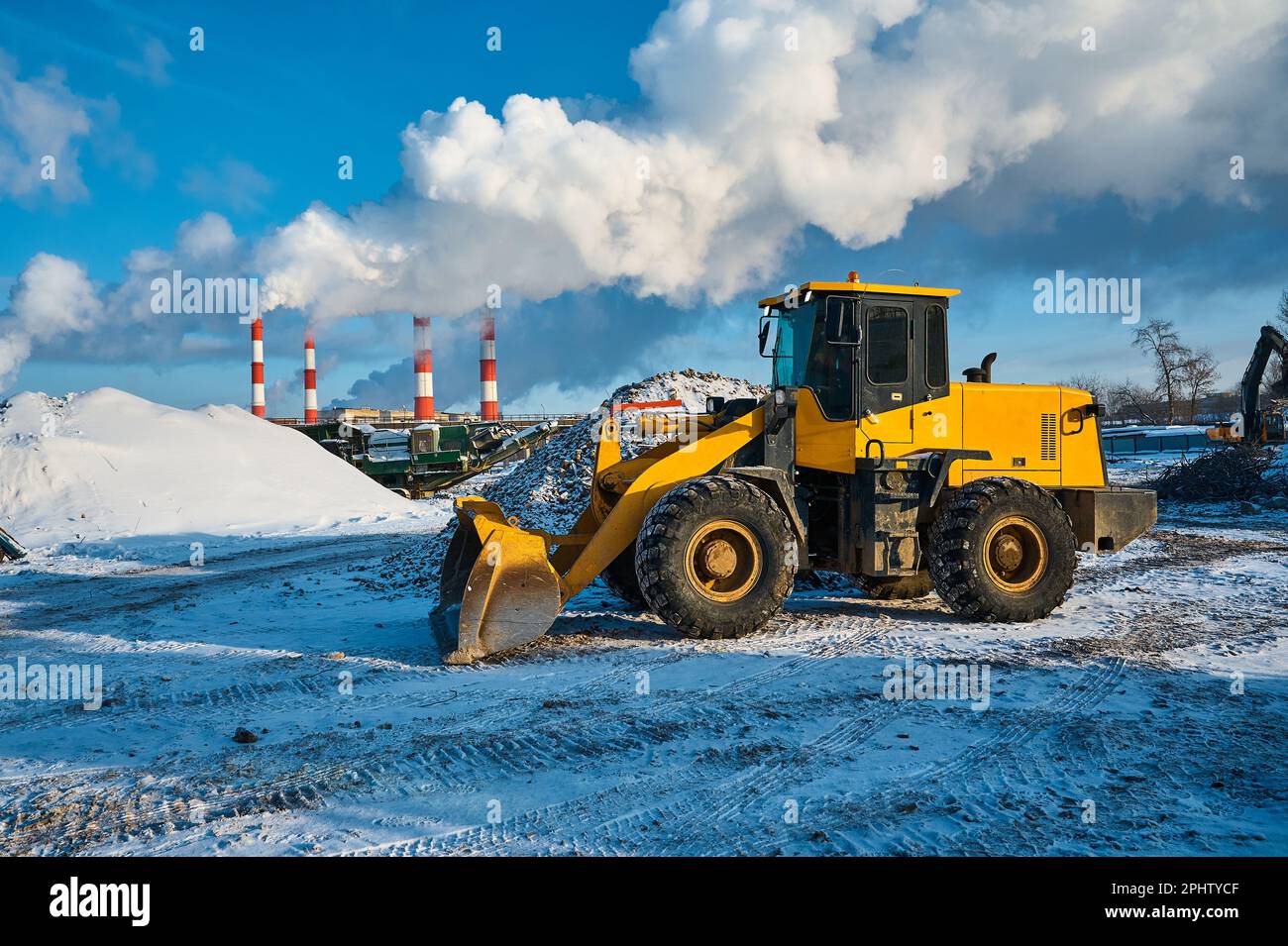 Clean Wheel Loader Cleaning of the territory hi-res stock photography and images - Alamy