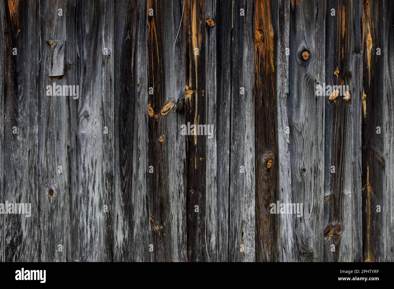 Old weathered dark wood building background Stock Photo