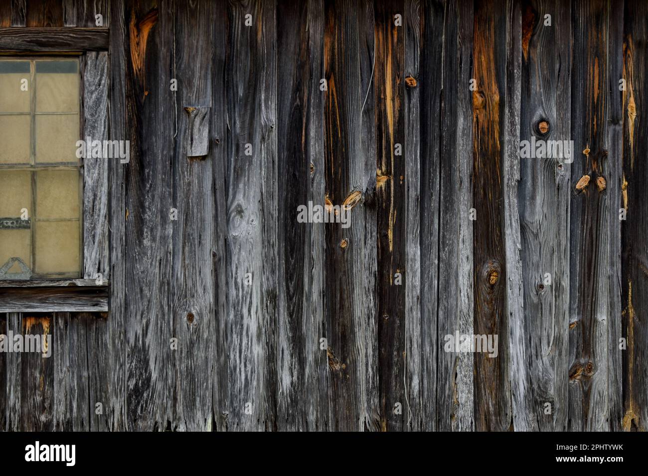 Old weathered wood building and window Stock Photo